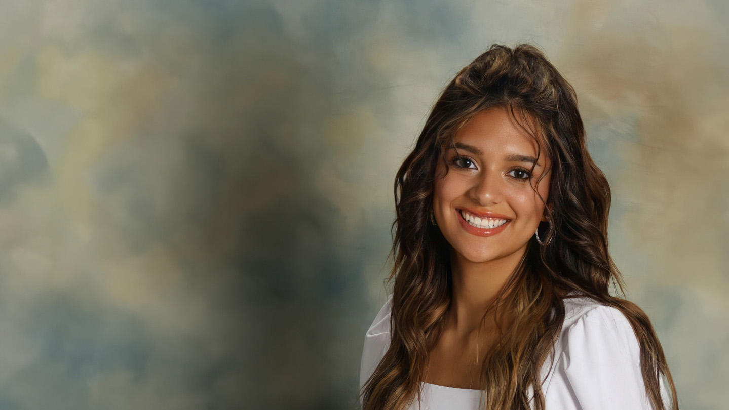 Arabella Driscoll, a young woman with long dark hair smiling