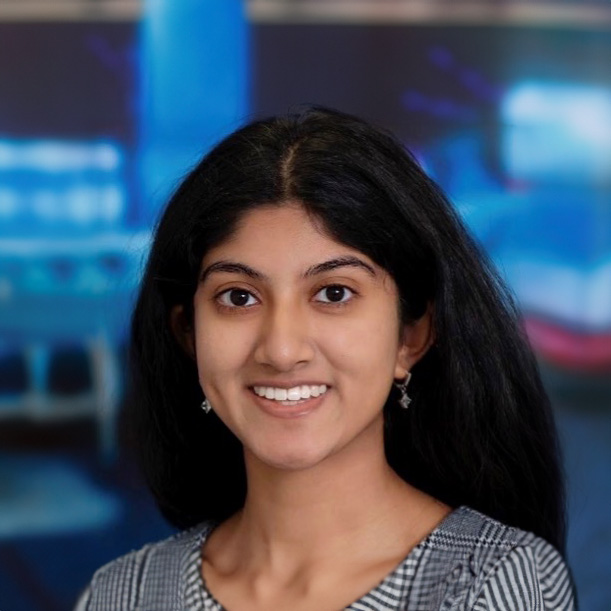 Anjali Raju, a young woman with long dark hair smiling